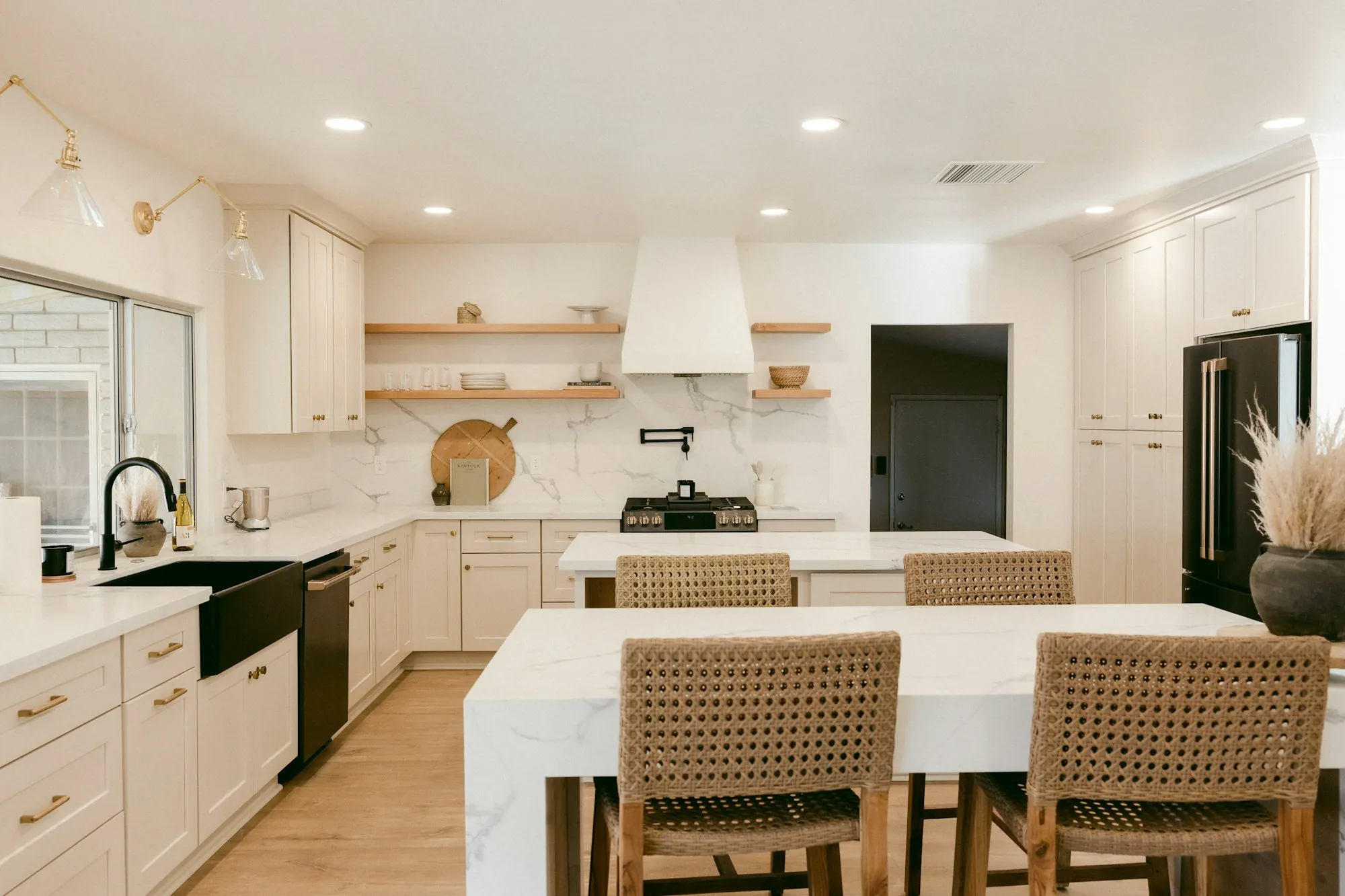 Open-plan kitchen and dining area with new pendant lighting