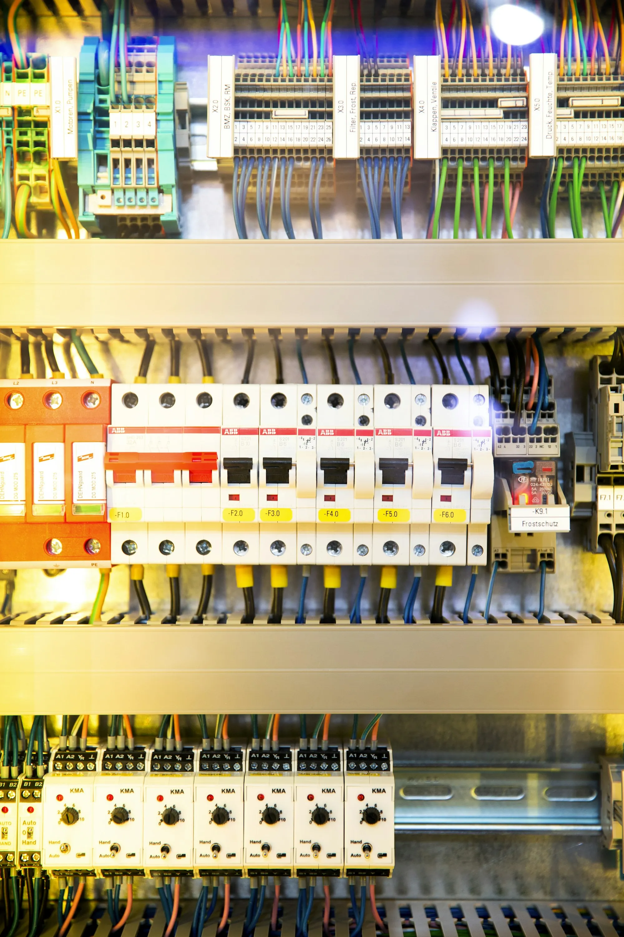 Close view of breaker modules and wiring in an electrical cabinet